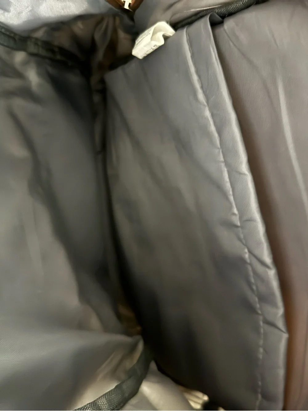 cream and brown colored backpack